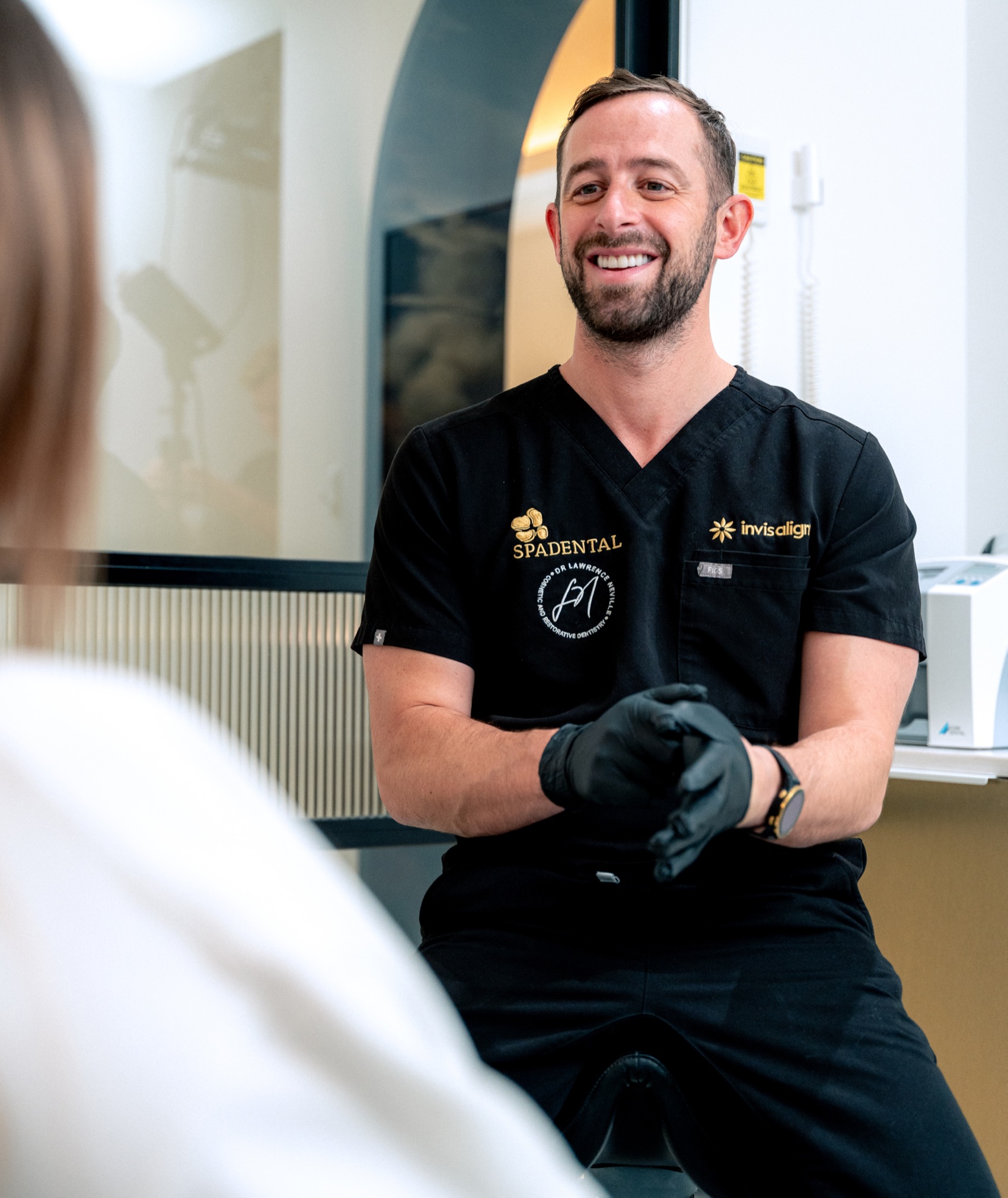 A Spa Dental dentist talking with a patient in the surgery