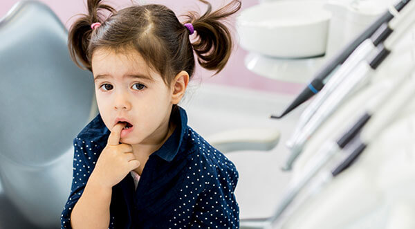When should my child first see the dentist?