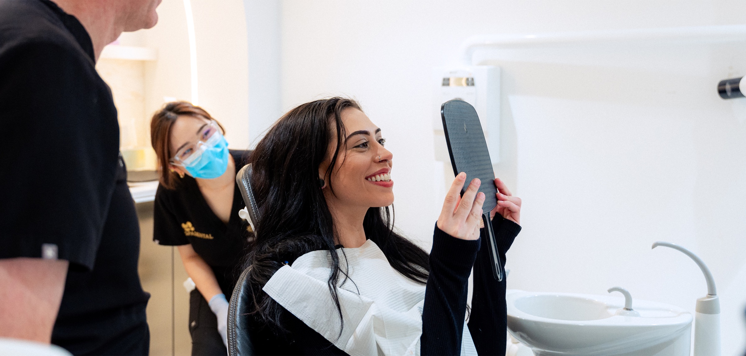 A Spa Dental dentist treating a patient during an Invisalign® consultation