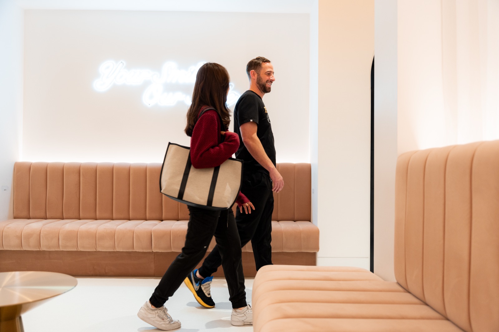 Two members of the Spa Dental team walking through the clinic