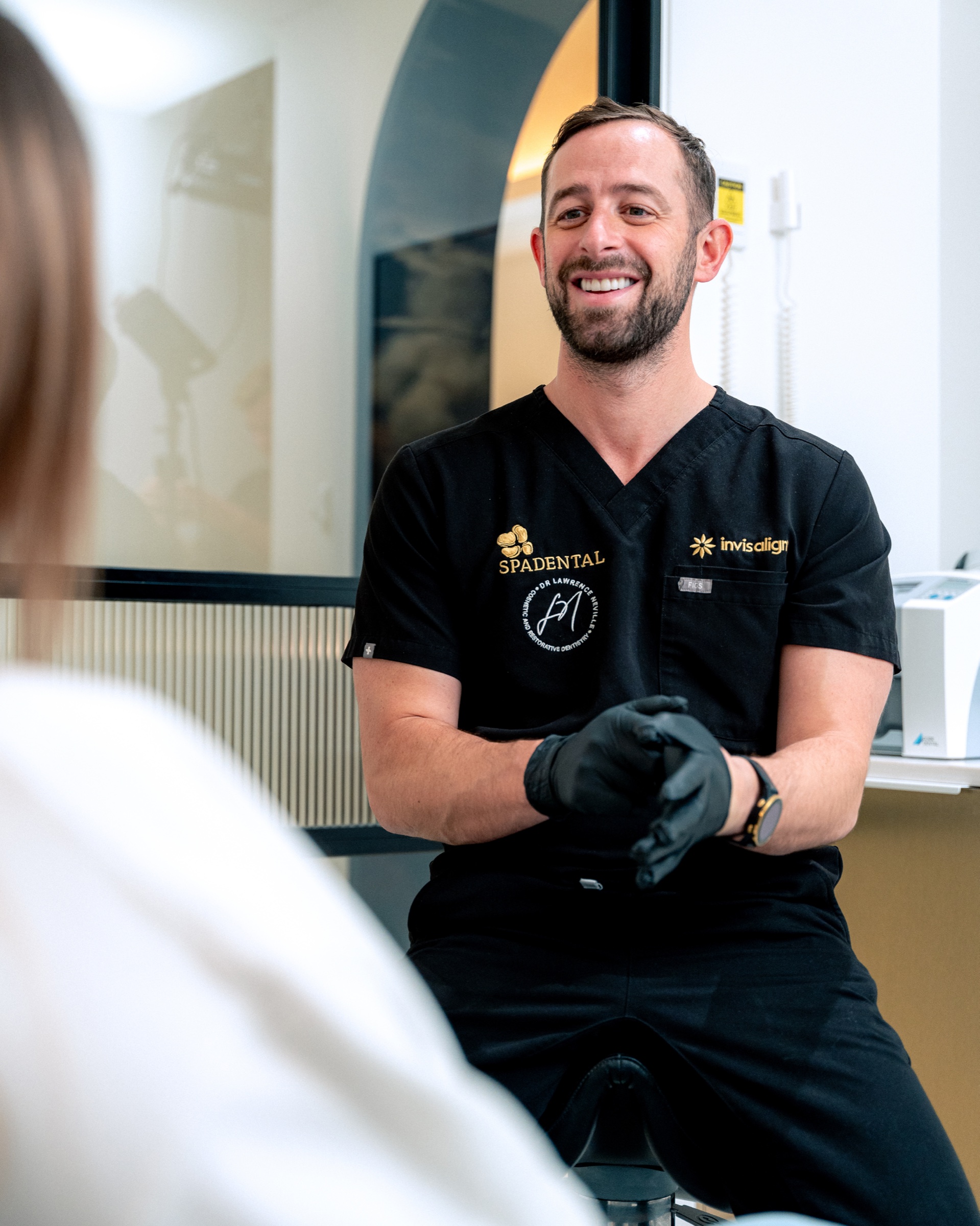 A dentist matching a filling shade at Spa Dental