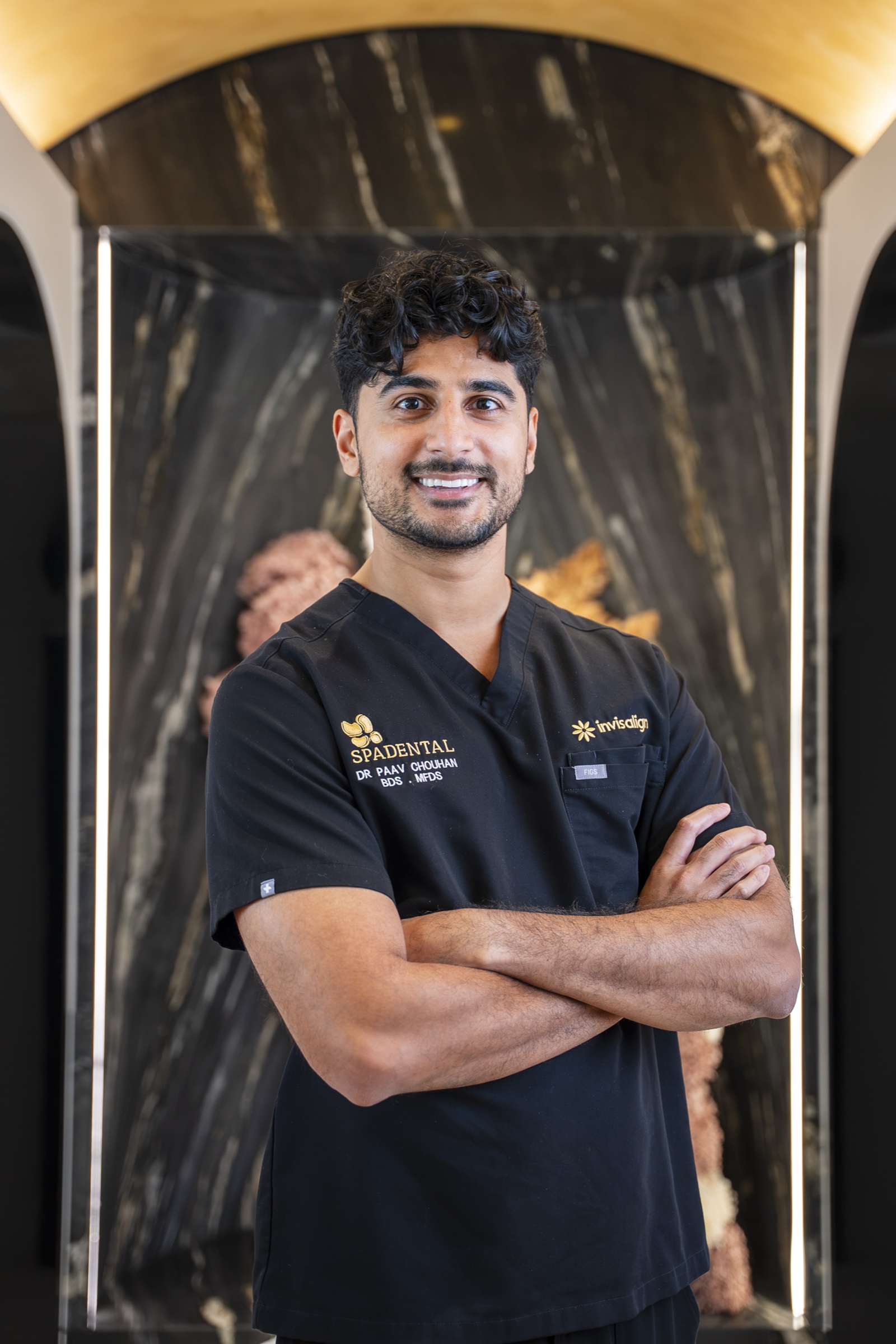A dentist explaining root canal treatment with a model at Spa Dental